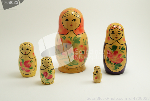 Image of five traditional Russian nesting dolls on white 