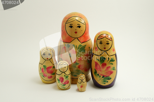 Image of five traditional Russian nesting dolls on white