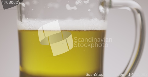 Image of Large mug of beer on the table slow motion footage