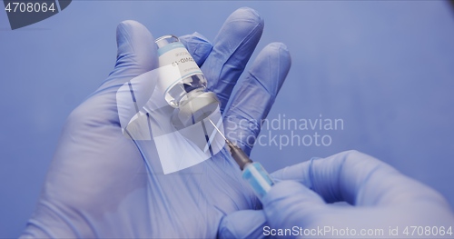 Image of Vaccine in human hands closeup footage