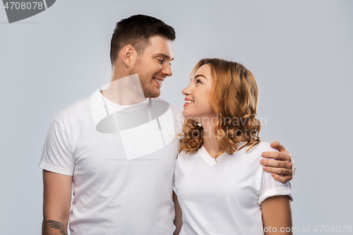 Image of portrait of happy couple in white t-shirts