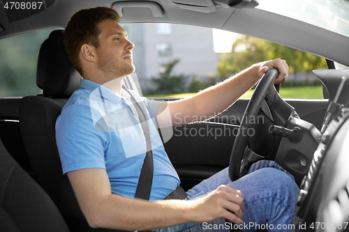 Image of man or driver driving car