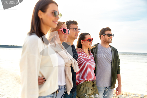 Image of happy friends on summer beach