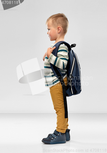 Image of portrait of smiling boy with school backpack