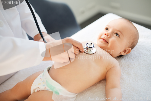 Image of doctor with stethoscope listening to baby patient