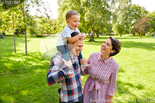 Image of happy family having fun at summer park