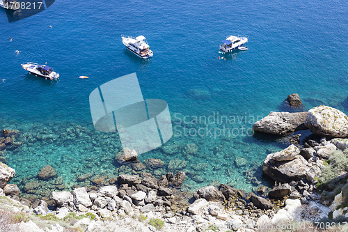 Image of Boats near a rock stone coast. San Domino island, Italy: scenic 