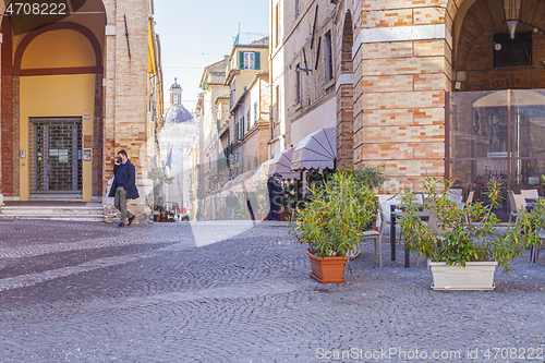 Image of Macerata, Italy - February 21, 2021: People enjoying sunny day.