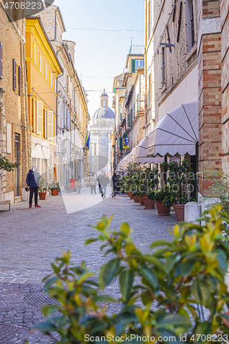 Image of Macerata, Italy - February 21, 2021: People enjoying sunny day.