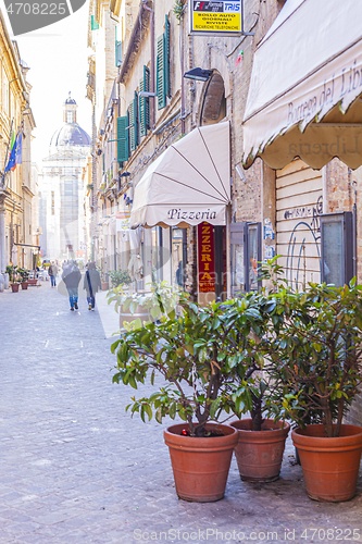 Image of Macerata, Italy - February 21, 2021: People enjoying sunny day.