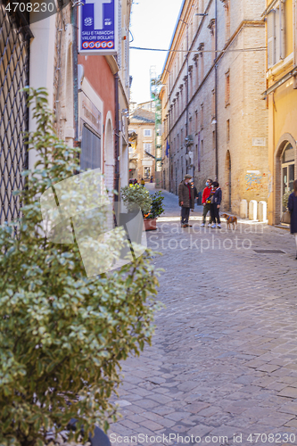 Image of Macerata, Italy - February 21, 2021: People enjoying sunny day.