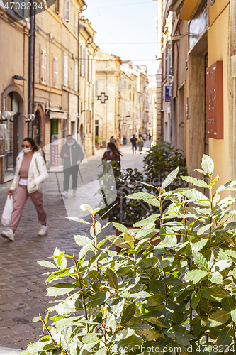 Image of Macerata, Italy - February 21, 2021: People enjoying sunny day.