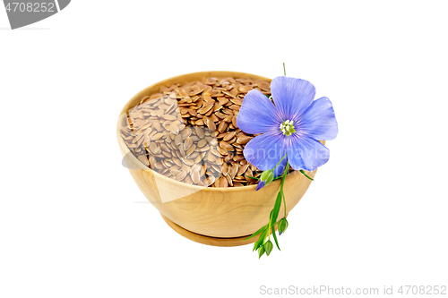 Image of Flaxen brown seed in bowl with flower