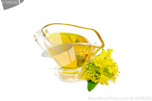Image of Oil mustard in gravy boat with flower