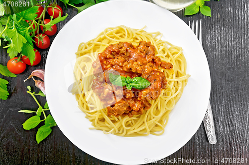 Image of Spaghetti with bolognese on dark board top