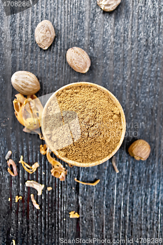 Image of Nutmeg round in bowl on dark board top