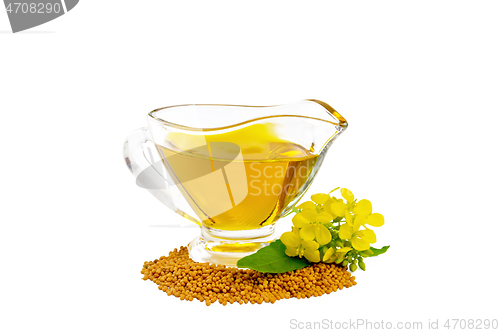 Image of Oil mustard in gravy boat with seeds and flower