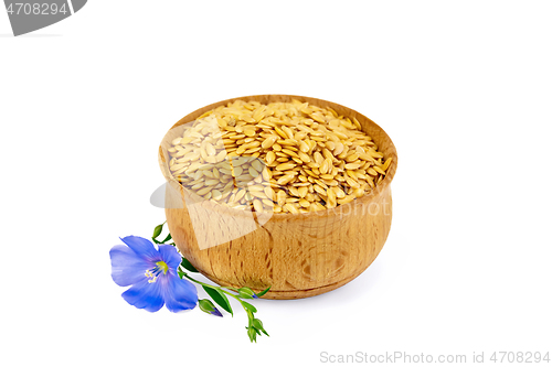 Image of Flaxen white seed in bowl with flower