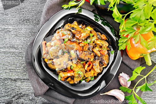 Image of Ragout with eggplant and pepper on dark board top