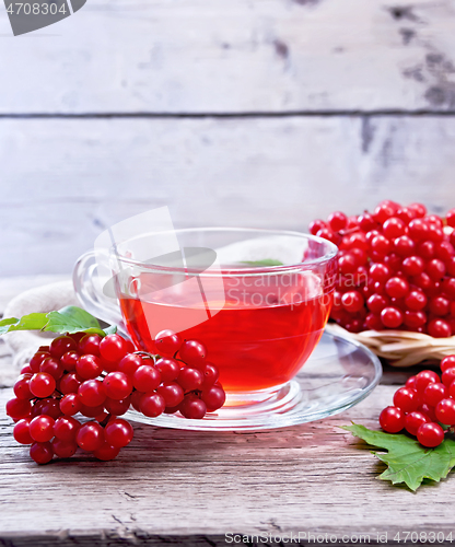 Image of Tea from viburnum in cup on old board