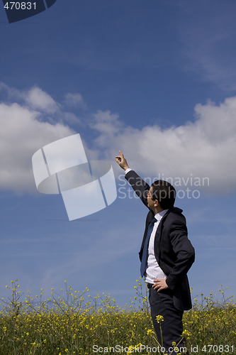 Image of Businessman showing the future