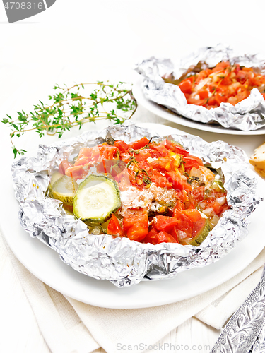 Image of Salmon with vegetables in plate on white board