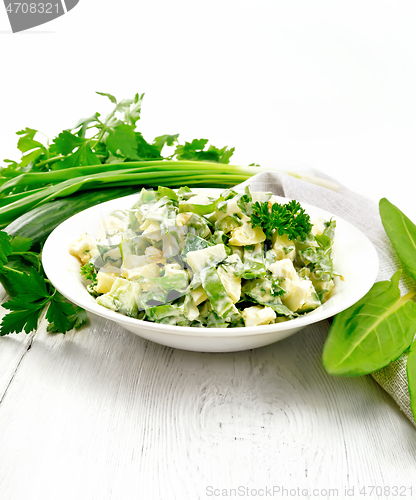 Image of Salad with potatoes and sorrel on wooden light board