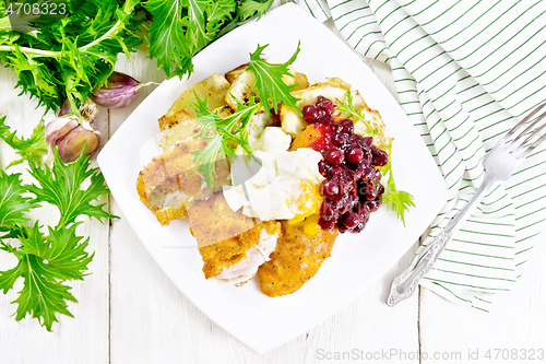 Image of Turkey breast with cranberry sauce on board top