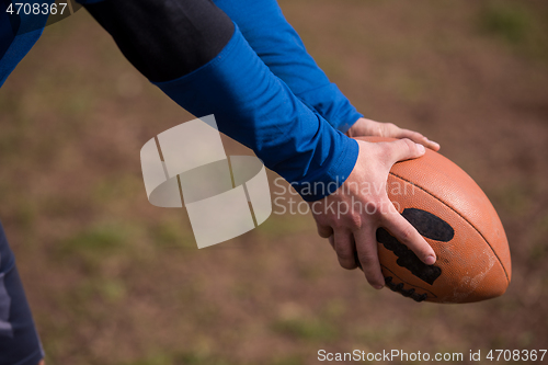 Image of american football kicker practicing kickoff