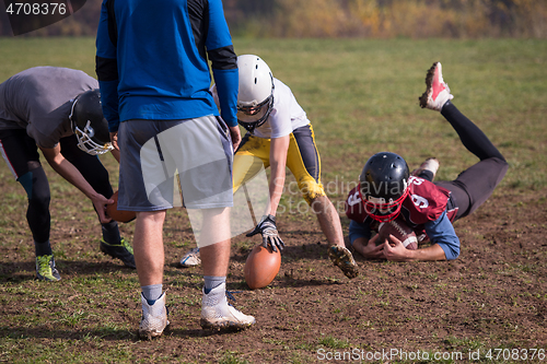 Image of american football team in action