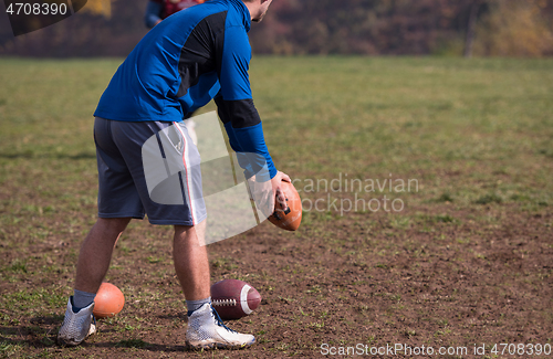 Image of american football kicker practicing kickoff