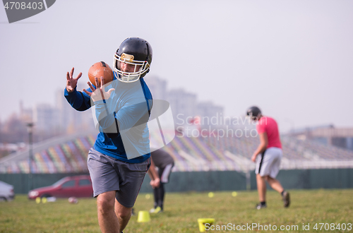 Image of american football team in action