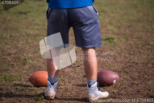 Image of american football kicker practicing kickoff