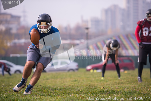 Image of american football team in action