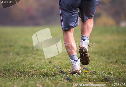 Image of american football player exercises on ladder drills