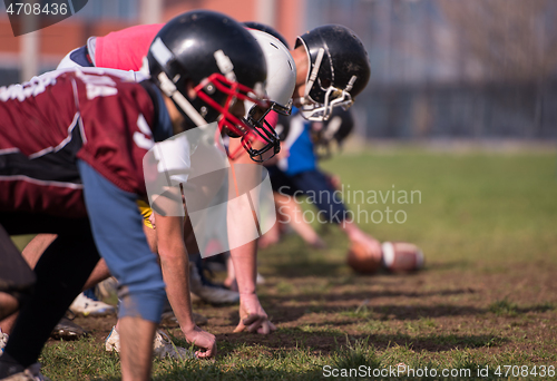 Image of american football team in action