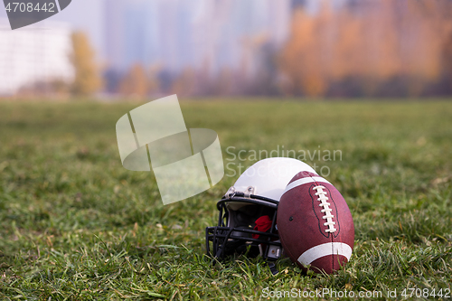 Image of American football helmet and ball