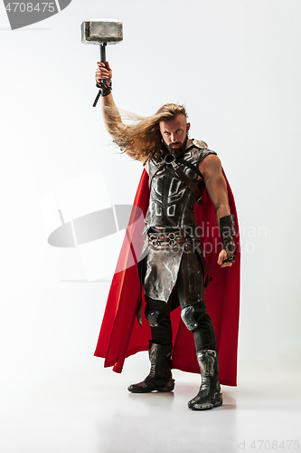 Image of Man in cosplaying Thor isolated on white studio background