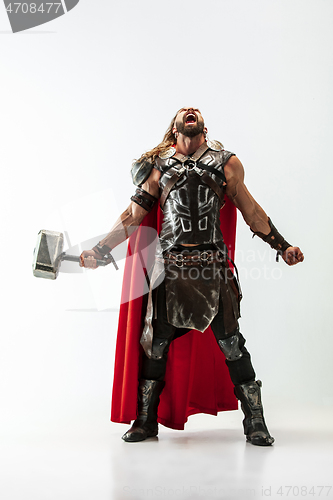 Image of Man in cosplaying Thor isolated on white studio background