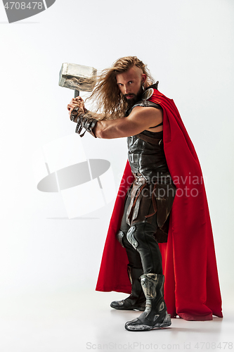 Image of Man in cosplaying Thor isolated on white studio background