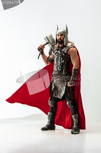 Image of Man in cosplaying Thor isolated on white studio background
