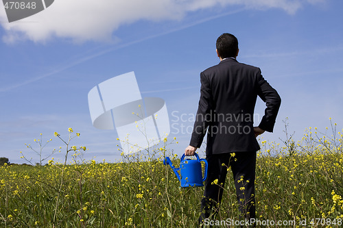 Image of businessman with a flowerpot