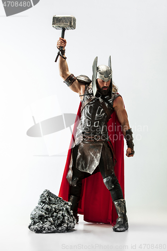 Image of Man in cosplaying Thor isolated on white studio background