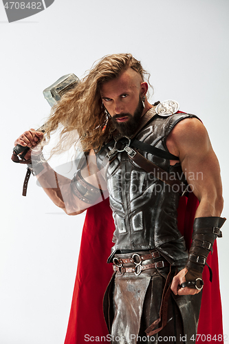 Image of Man in cosplaying Thor isolated on white studio background