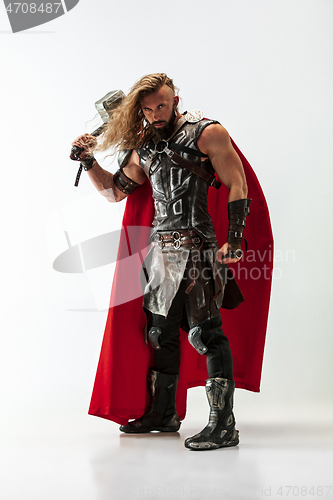 Image of Man in cosplaying Thor isolated on white studio background