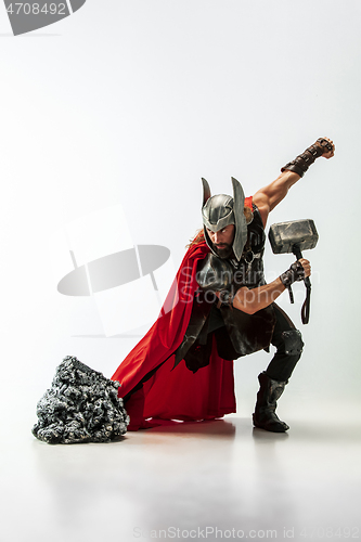 Image of Man in cosplaying Thor isolated on white studio background