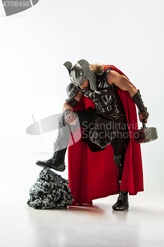 Image of Man in cosplaying Thor isolated on white studio background