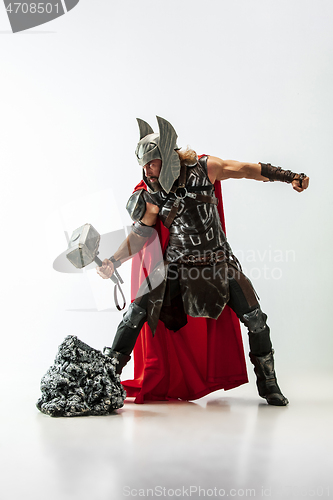 Image of Man in cosplaying Thor isolated on white studio background