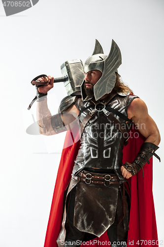 Image of Man in cosplaying Thor isolated on white studio background