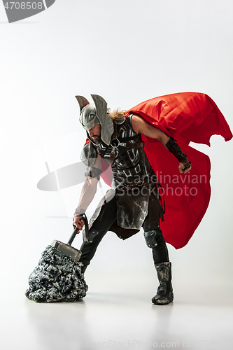 Image of Man in cosplaying Thor isolated on white studio background